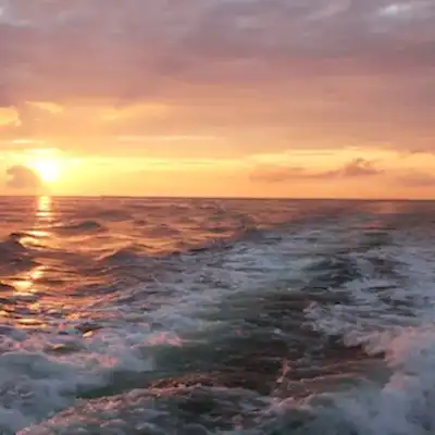 a sunset over a body of water