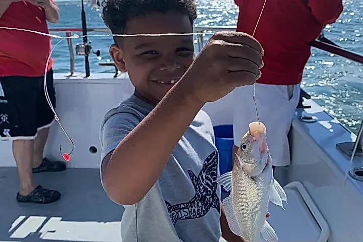 a person holding a fish