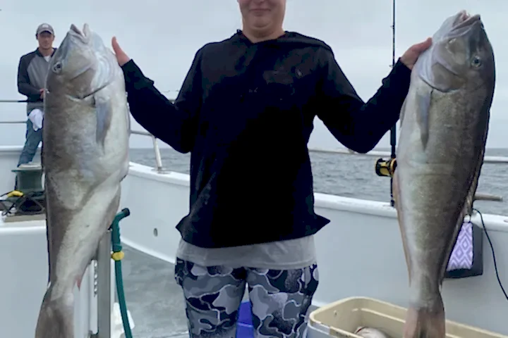 a man holding a fish