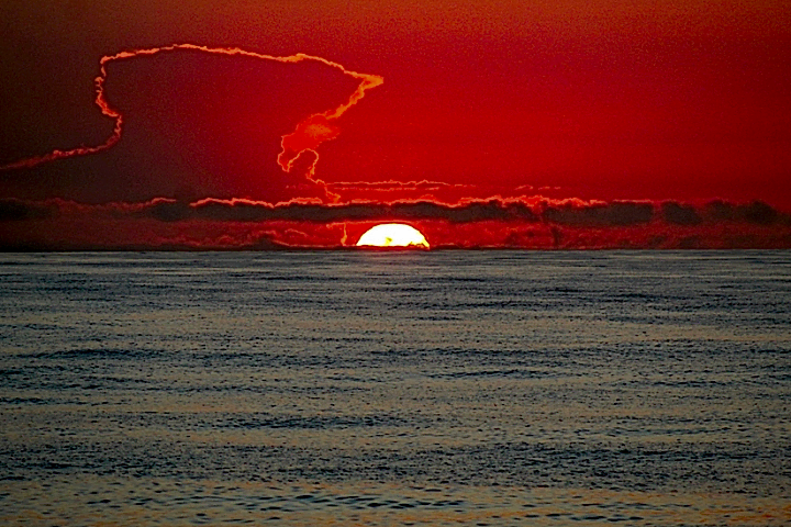 a sunset over the water