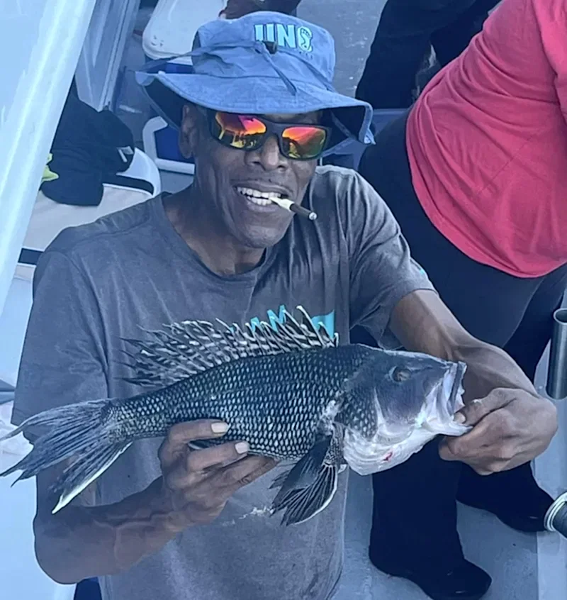 a man holding a fish