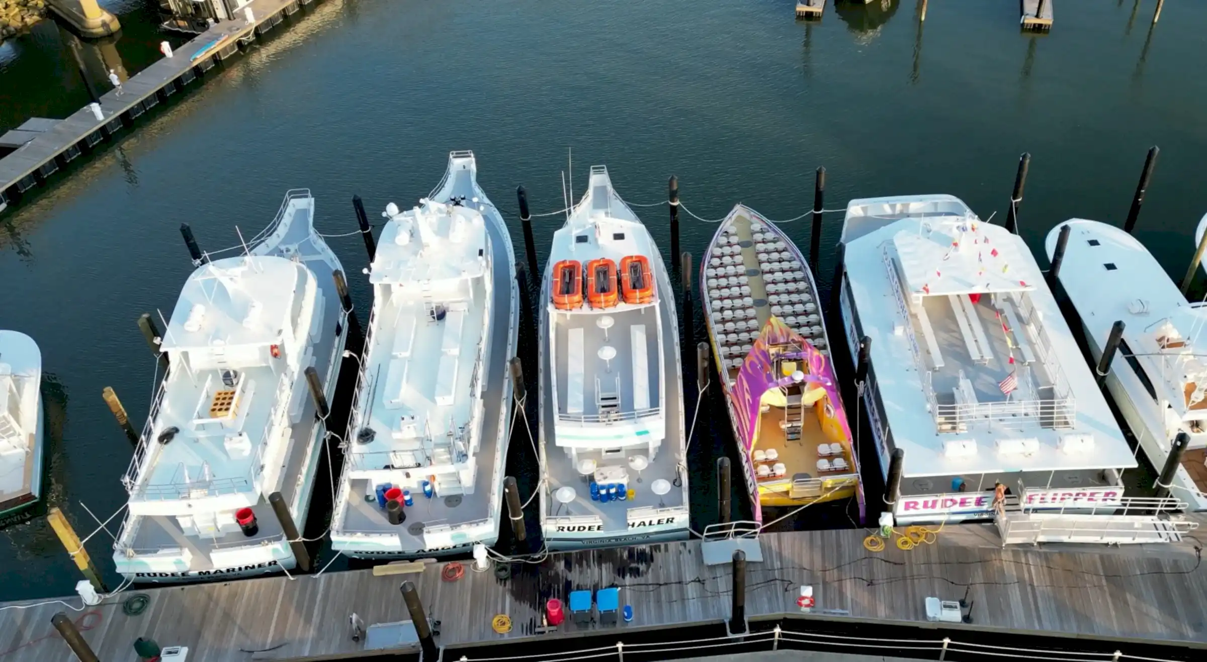 Aerial view of our 5 boats docked at the marina.